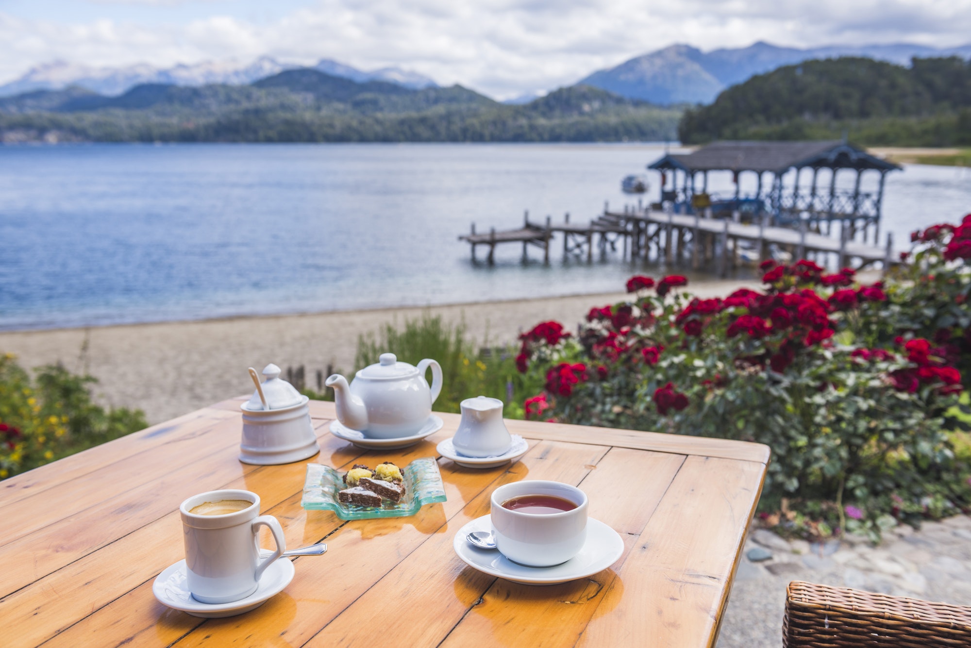 Tea and coffee at a cafe by a lake with amazing Andes Mountains landscape views, Villa la Angostura,