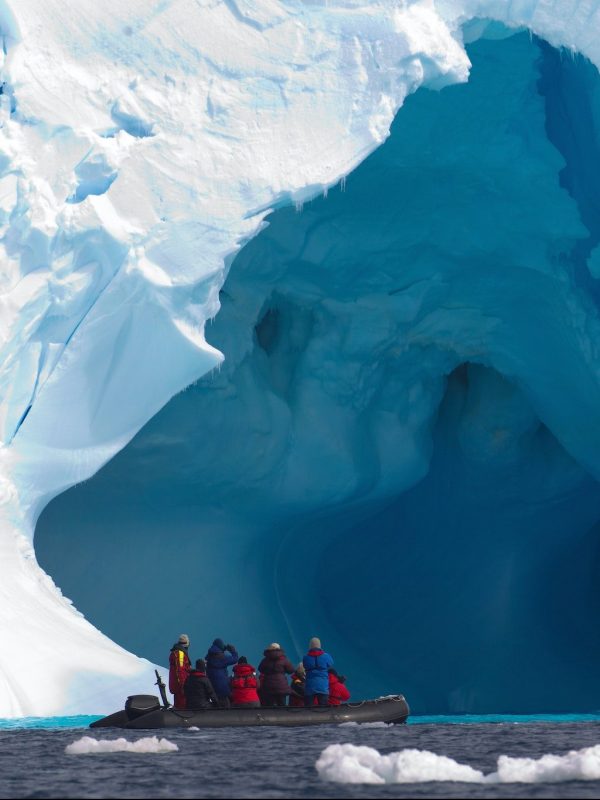 Boat and iceberg, ice floe in the Southern Ocean, 180 miles north of East Antarctica, Antarctica